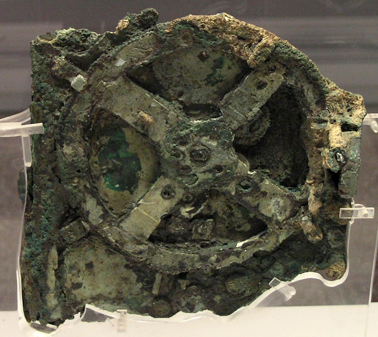 The Antikythera mechanism, a corroded bronze ancient Greek device with visible gear wheels